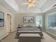 Main bedroom featuring neutral walls, carpeted flooring, and a large window for ample natural light at 8640 Swarthmore Dr, Raleigh, NC 27615