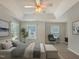 Spacious main bedroom features tray ceiling, sitting area and neutral decor at 8640 Swarthmore Dr, Raleigh, NC 27615