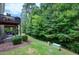 Expansive backyard featuring lush landscaping and a multi-level deck, perfect for outdoor living at 8715 Macedonia Lake Dr, Cary, NC 27518