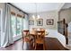 Charming dining area with natural lighting, hardwood floors, and stylish decor at 8715 Macedonia Lake Dr, Cary, NC 27518
