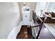 View of the foyer from the staircase featuring a stylish front door and neutral wall paint at 8715 Macedonia Lake Dr, Cary, NC 27518