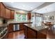 Well-appointed kitchen with an island, granite counters, and a bright, sunny dining area at 8715 Macedonia Lake Dr, Cary, NC 27518