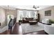 Bright living room featuring large windows, hardwood floors, and comfortable seating at 8715 Macedonia Lake Dr, Cary, NC 27518