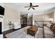 Bright living room showcasing a cozy sofa, fireplace, and elegant decor with views to the upstairs landing at 8715 Macedonia Lake Dr, Cary, NC 27518