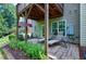Stone patio with lounge chairs and lush greenery offering a relaxing outdoor space at 8715 Macedonia Lake Dr, Cary, NC 27518