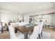 Bright living space with an open floor plan, seamlessly connecting the living, dining, and kitchen areas at 892 Nichols View Ct, Raleigh, NC 27604