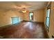 A light-filled bedroom offers yellow walls, a vintage ceiling fan, and a small window at 94 Bynum Church Rd, Pittsboro, NC 27312