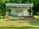 Bynum Front Porch outdoor stage, perfect for events and gatherings in a green space at 94 Bynum Church Rd, Pittsboro, NC 27312