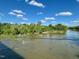Scenic river view with clear skies and lush greenery along the banks at 94 Bynum Church Rd, Pittsboro, NC 27312