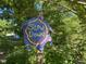 Handcrafted 'Slow Down' sign surrounded by lush greenery at 94 Bynum Church Rd, Pittsboro, NC 27312