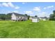 Large backyard featuring green space and a shed at 99 Winwood Dr, Angier, NC 27501