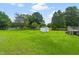 The expansive backyard offers ample space for outdoor activities at 99 Winwood Dr, Angier, NC 27501