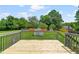 A wood deck overlooking the green backyard at 99 Winwood Dr, Angier, NC 27501