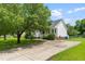 Charming single-story home with a long driveway, well-maintained lawn, and inviting front porch at 99 Winwood Dr, Angier, NC 27501