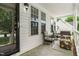 Inviting front porch with comfortable seating, perfect for relaxing and enjoying the outdoors at 99 Winwood Dr, Angier, NC 27501