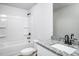 Well-lit bathroom featuring a shower-tub combo and vanity with a granite countertop at 1004 Rhino Bnd, Oxford, NC 27565