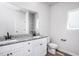 Modern bathroom featuring a double sink vanity with granite countertop and matte black fixtures at 1004 Rhino Bnd, Oxford, NC 27565