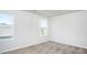 Comfortable bedroom featuring soft carpeting and large windows offering pleasant views at 1004 Rhino Bnd, Oxford, NC 27565