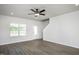 Bright living room with a ceiling fan, lots of natural light, and neutral paint at 1004 Rhino Bnd, Oxford, NC 27565