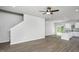 Open-concept living room with stairs, neutral paint, and laminate flooring throughout at 1004 Rhino Bnd, Oxford, NC 27565