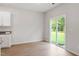 Bright dining area with sliding glass door, hardwood floors, and ample space at 101 Flue Ct, Oxford, NC 27565