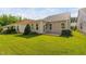 Well-manicured lawn and patio enhance this home's outdoor living space at 1019 Santiago St, Durham, NC 27703