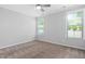 Spacious bedroom featuring neutral walls, carpet, and a bright window at 1019 Santiago St, Durham, NC 27703