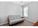 Bedroom with neutral walls, carpeted floor, and daybed at 1019 Santiago St, Durham, NC 27703