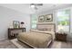 Cozy bedroom featuring natural light, ceiling fan, and neutral decor at 1019 Santiago St, Durham, NC 27703