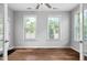 Bright bedroom features hardwood floors, two windows, and natural light at 1019 Santiago St, Durham, NC 27703
