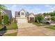 Charming two-story home with a two car garage, quaint landscaping, and covered porch at 1019 Santiago St, Durham, NC 27703