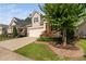 Well maintained lawn and landscaping in front yard at 1019 Santiago St, Durham, NC 27703