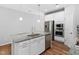 Island in the kitchen with granite countertops, stainless steel appliances and sleek fixtures at 1019 Santiago St, Durham, NC 27703
