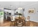 A modern kitchen features white cabinets, stainless steel appliances, and a breakfast nook at 1019 Santiago St, Durham, NC 27703