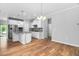 Bright, open kitchen with granite counters, stainless appliances, and adjoining living space at 1019 Santiago St, Durham, NC 27703