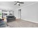 Bright living room with neutral paint, plush carpeting, and an open layout at 1019 Santiago St, Durham, NC 27703