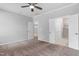 Spacious main bedroom with carpet, a ceiling fan and ensuite bathroom and a doorway to another room at 1019 Santiago St, Durham, NC 27703