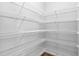 Spacious walk-in pantry with ample shelving for organized storage at 1019 Santiago St, Durham, NC 27703