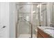 Elegant shower featuring glass door and decorative tile at 1019 Santiago St, Durham, NC 27703