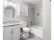 Bathroom with tile flooring, vanity with granite countertop, tub-shower combo with tile surround at 102 Emerald Cir, Durham, NC 27713