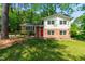 Charming two-story home with a brick and siding exterior and a bright red front door at 102 Emerald Cir, Durham, NC 27713