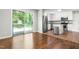 Eat-in kitchen with modern stainless steel appliances and granite countertops with backyard views at 102 Emerald Cir, Durham, NC 27713