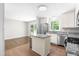 Modern kitchen with stainless steel appliances, granite countertops, and a large eat-in area at 102 Emerald Cir, Durham, NC 27713