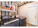 Laundry room with modern washer and dryer units and a door leading to an outside space at 102 Emerald Cir, Durham, NC 27713