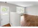 Inviting living room featuring hardwood floors, a modern paint scheme and lots of natural light at 102 Emerald Cir, Durham, NC 27713