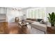 Bright living room with hardwood floors, neutral furnishings, and large windows at 102 Emerald Cir, Durham, NC 27713