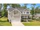 Inviting two-story home with a well-manicured lawn and attached two-car garage at 103 Foothill Ct, Sanford, NC 27330