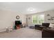 Cozy living room with a plush sectional sofa, TV, and ' toys, perfect for Gathering time at 103 Foothill Ct, Sanford, NC 27330