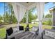 Relaxing screened porch with comfortable seating and views of the backyard at 103 Foothill Ct, Sanford, NC 27330