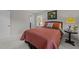 Bedroom features soft carpet, natural light, and closet access at 1040 Ivy Ln, Cary, NC 27511